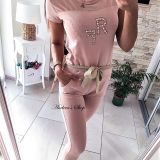 Puudriroosa jumpsuit vööga